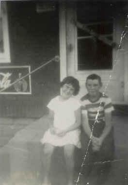  This photo was taken when the store was located in our house prior to the 1958 storefront addition.  Shown in the photo are my sister Peggy and our cousin Tommy Lavin, who lived a few houses away.