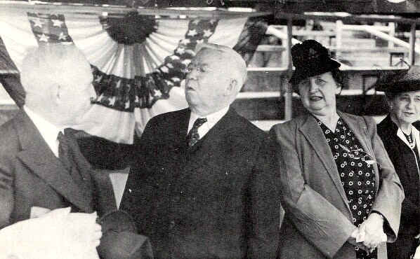 John Caldwell Hinkson congratulates his friend Judge John E. McDonough upon receiving the Doctor of Laws Degree from the college. At right are Mrs. McDonough and Miss Mary Hinkson. - Photo from The Delaware County Advocate, June 1942